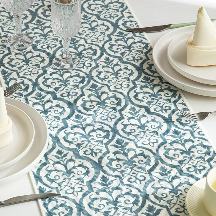 Woven table runner with flower jacquard, fringes and cotton blend