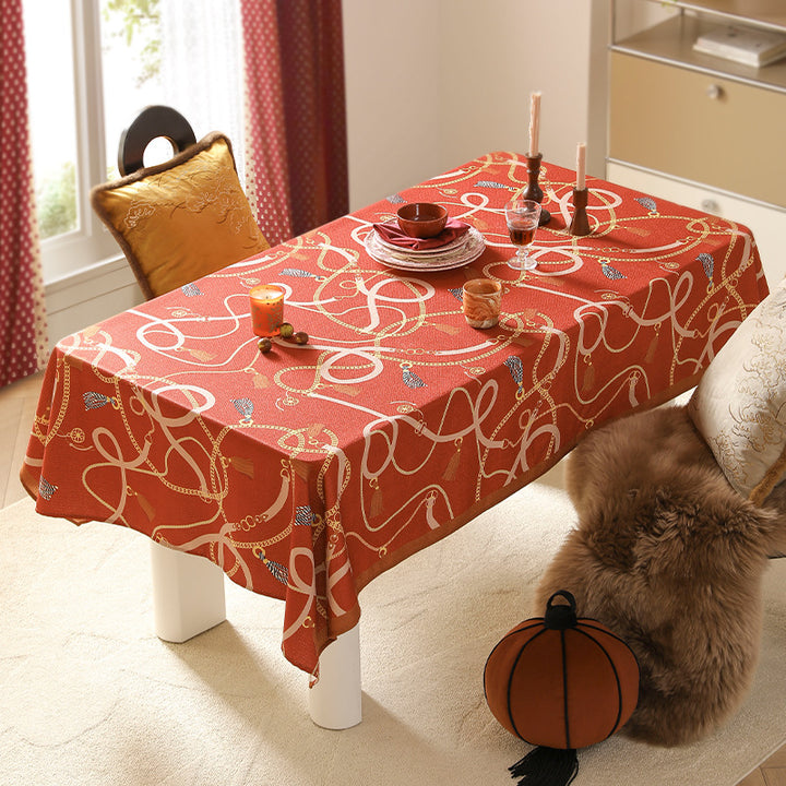 Rectangular decorative tablecloth with cord and tassel pattern as well as contrasted hem edge