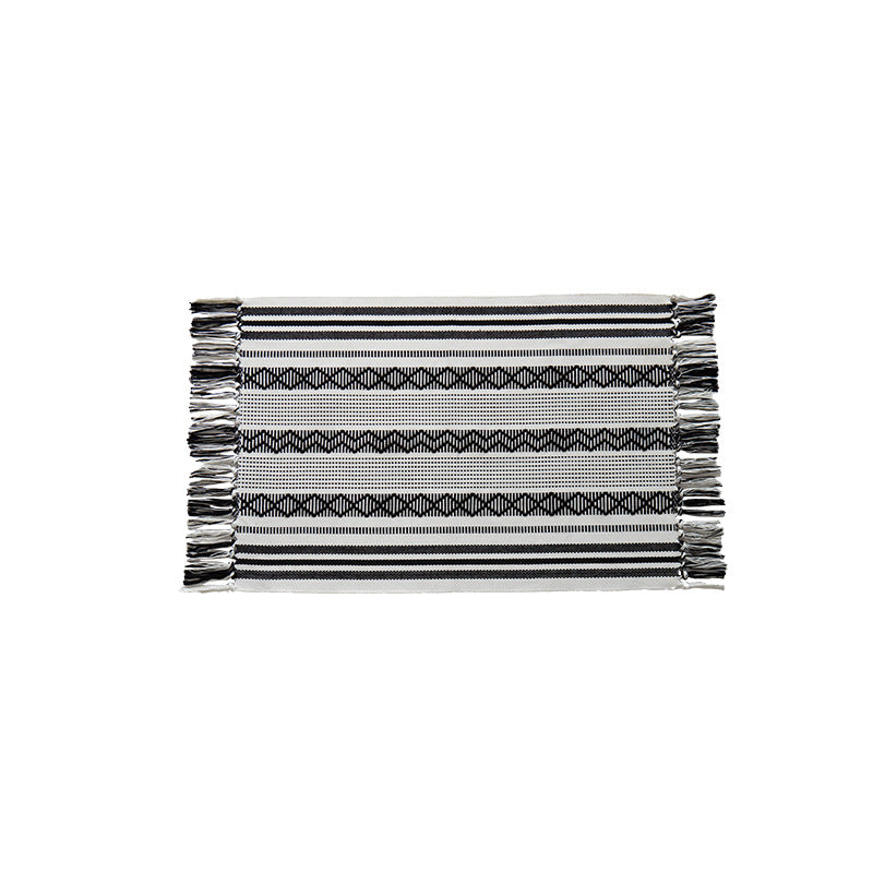 Flat-woven cotton runner with fringes and graphic ethnic stripe pattern