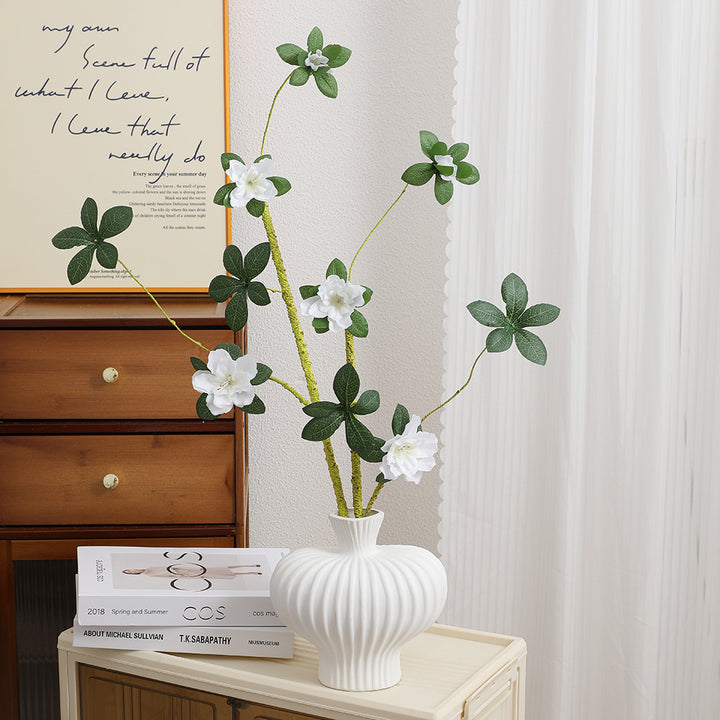 More elegant artificial flower branch with realistic blooms and leaves