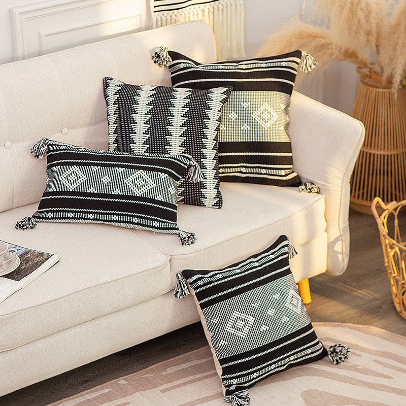 Decorative woven cushion cover with ethnic jacquard, tassels and concealed zipper
