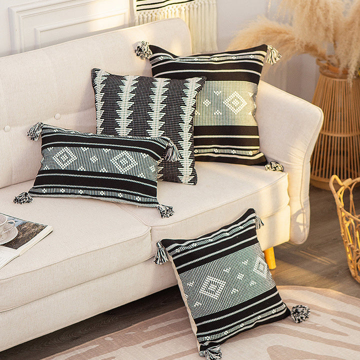 Decorative woven cushion cover with ethnic jacquard, tassels and concealed zipper