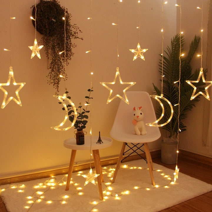 Hanging star and crescent moon LED curtain string lights for bedroom ambiance