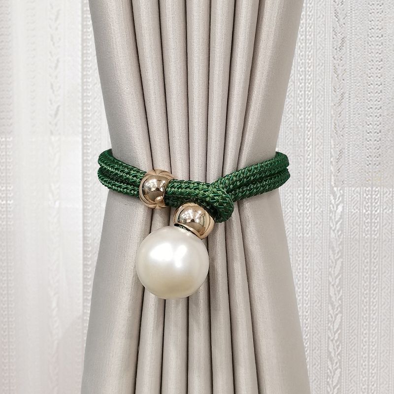 Elegant curtain tieback with decorative pearl