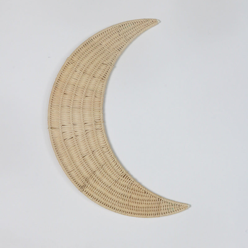 Wall decoration made of handwoven rattan in moon design