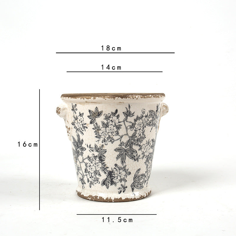 Decorative flower pot with floral embellishments