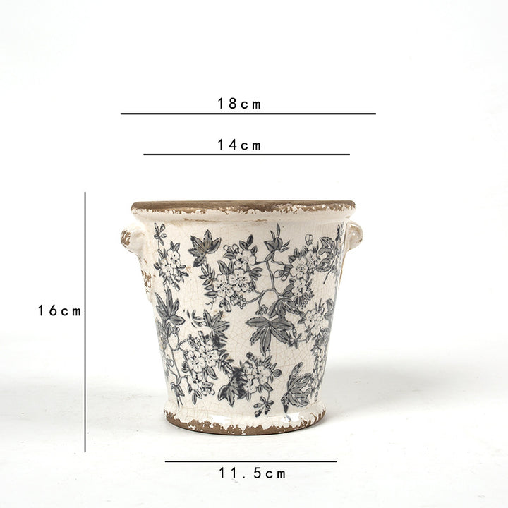 Decorative flower pot with floral embellishments