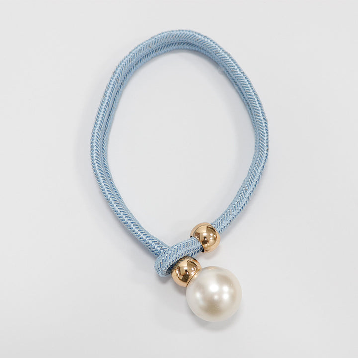 Elegant curtain tieback with decorative pearl