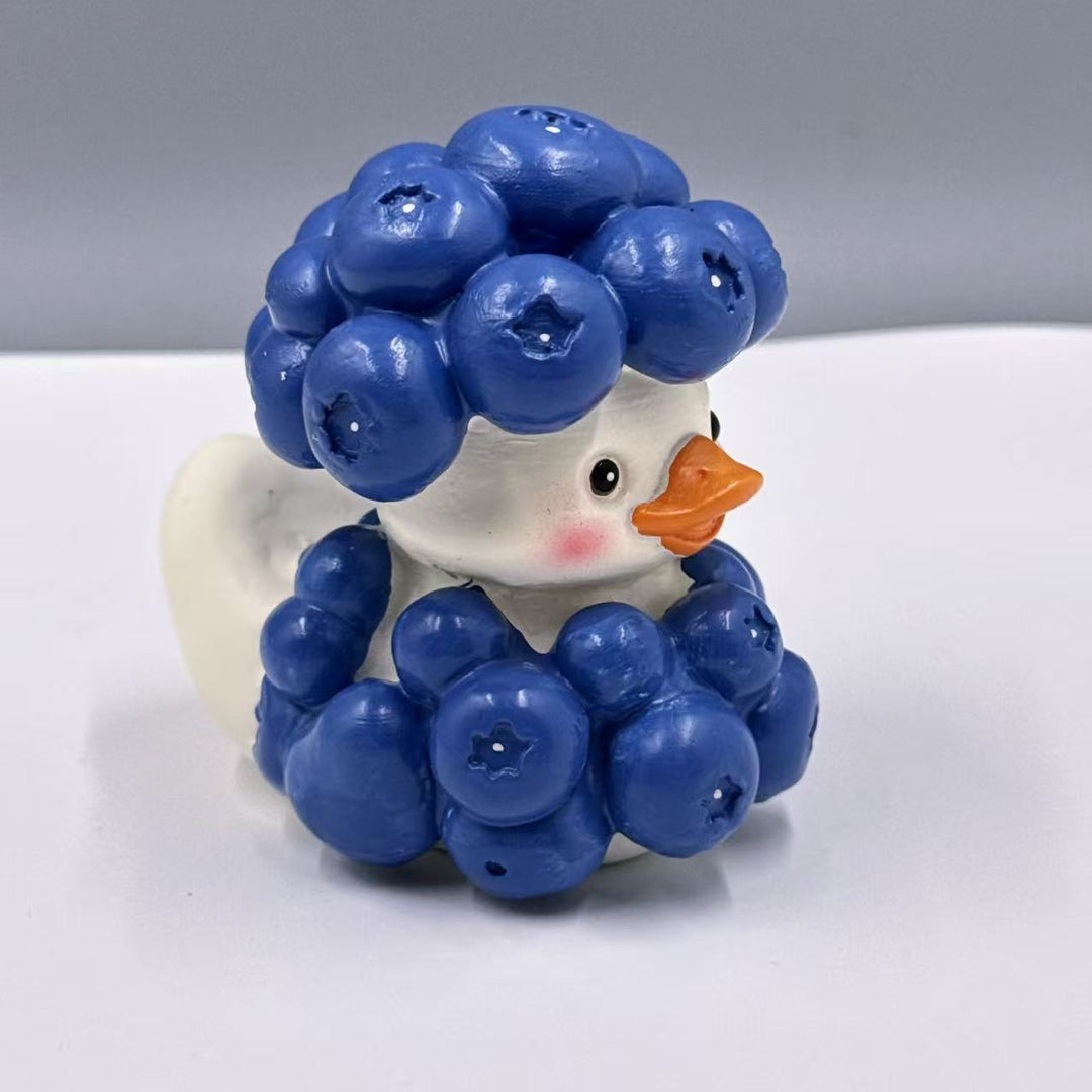 Decorative rubber duck with berry cocktail bowl