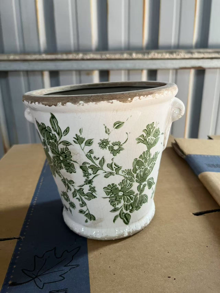 Decorative flower pot with floral embellishments