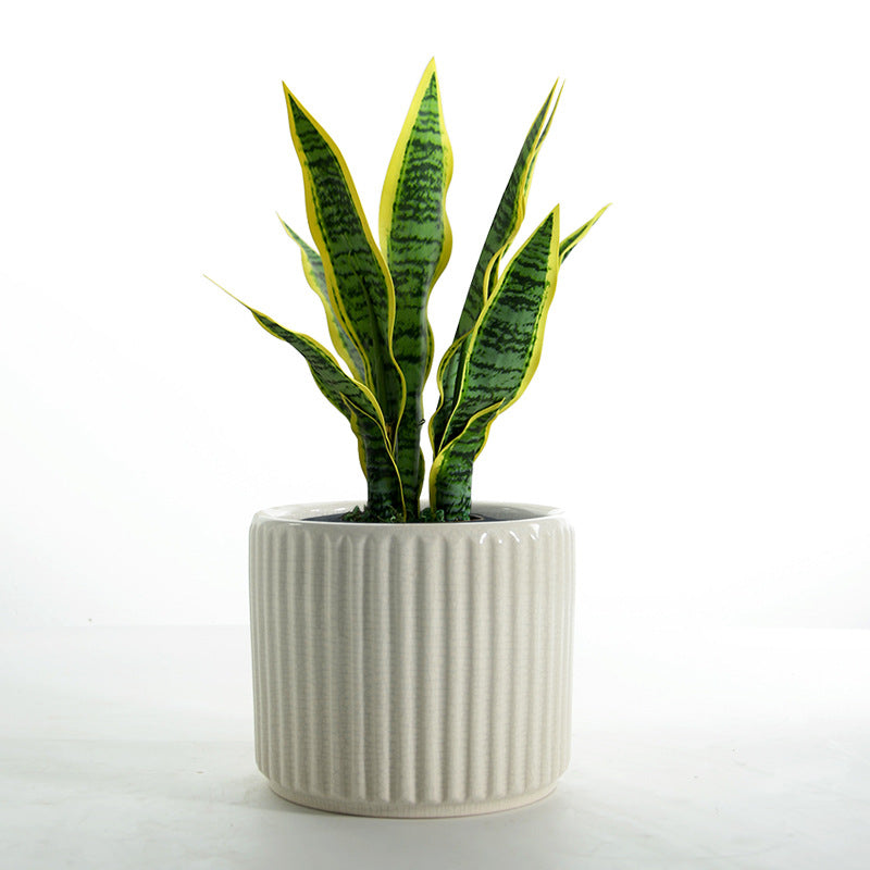 Elegant ceramic flower pot with ribbed structure