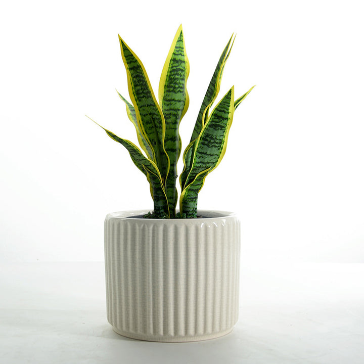 Elegant ceramic flower pot with ribbed structure