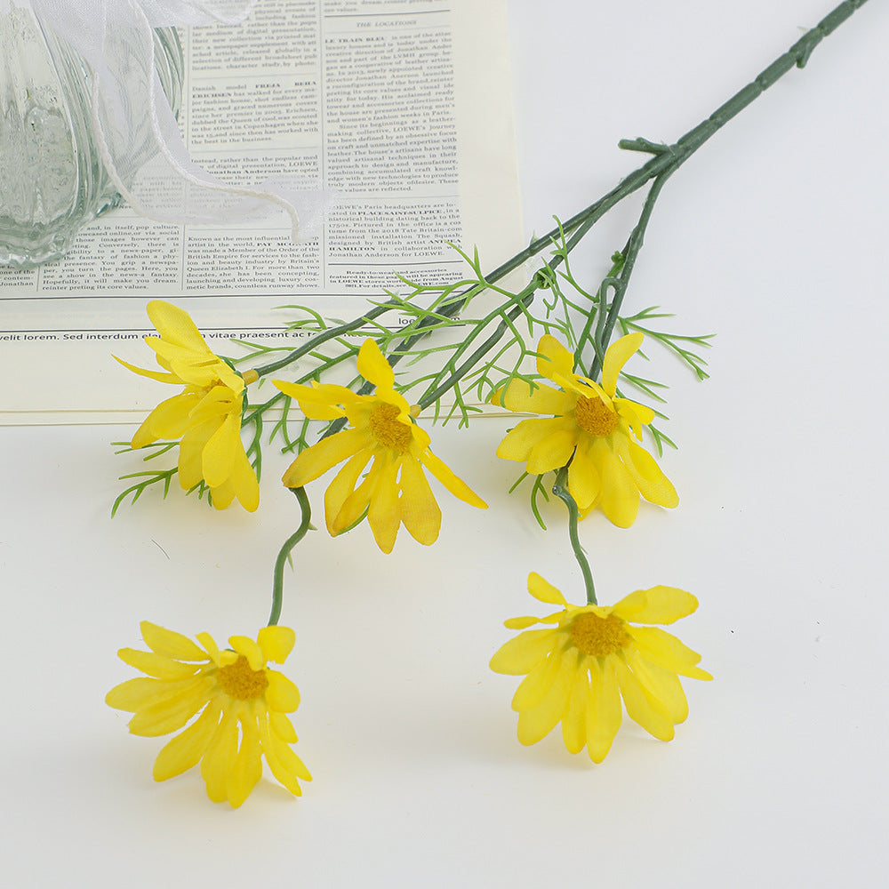 Artificial flower branch with bright blooms and delicate leaves