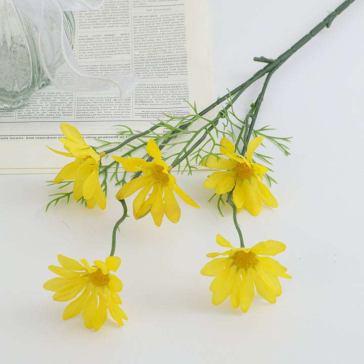 Artificial flower branch with bright blooms and delicate leaves