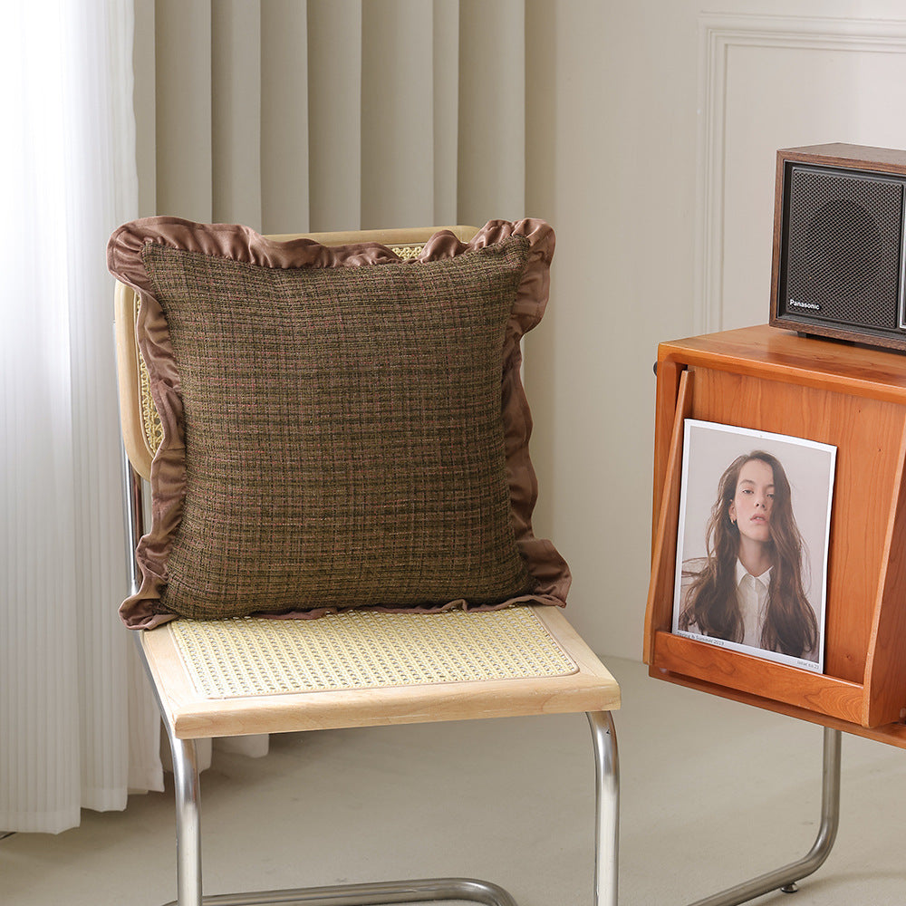 Decorative cushion with woven bouclé structure and velvet ruffled edge
