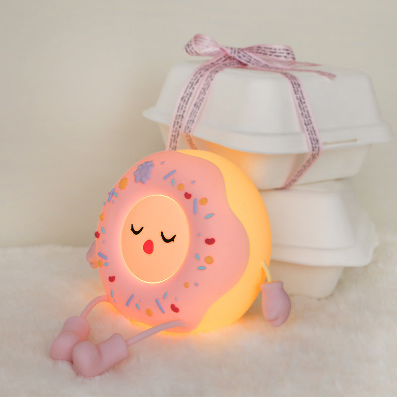 Whimsical silicone-shaped LED night light in donut form with flexible limbs