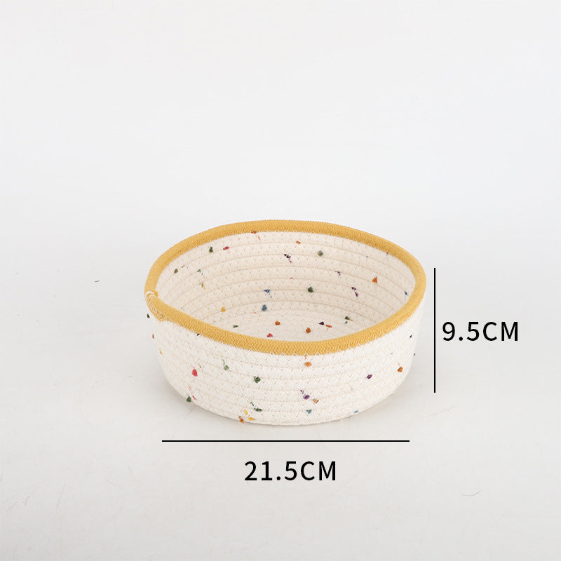 Storage basket made of natural cotton fabric with colorful dots