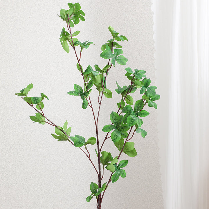 Decorative artificial branch with vibrant leaves
