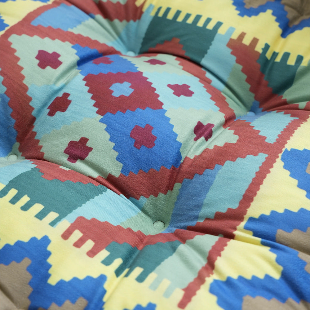Padded seat and floor cushion with carrying handle and graphic ethno pattern