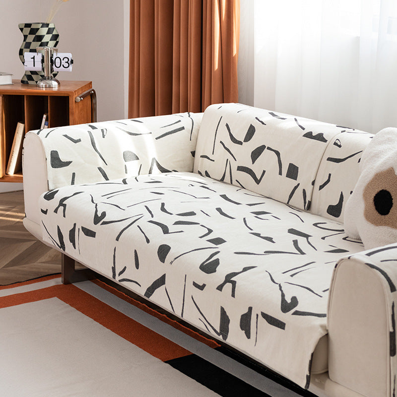 Stretch sofa cover with abstract brushstroke print and elastic waistband
