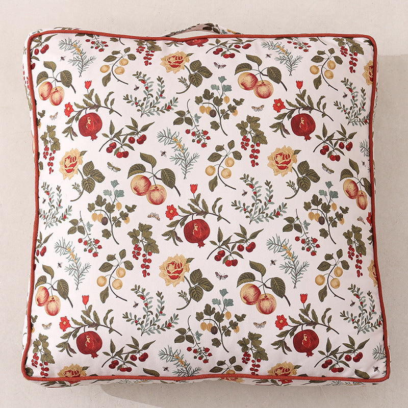 Large square floor cushion with floral cotton cover, piping, and carrying handle