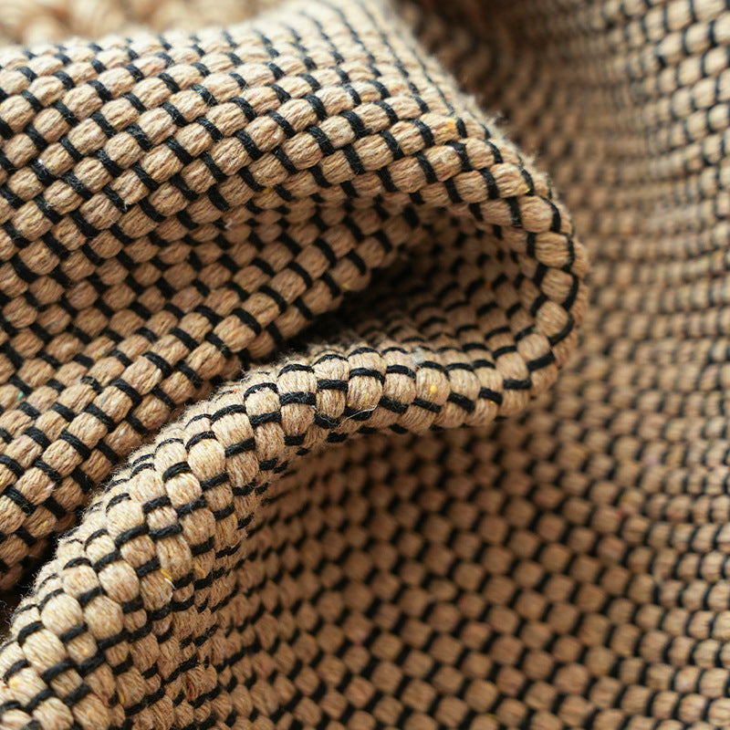 Handwoven structured cushion cover made of cotton blend with pompom trim