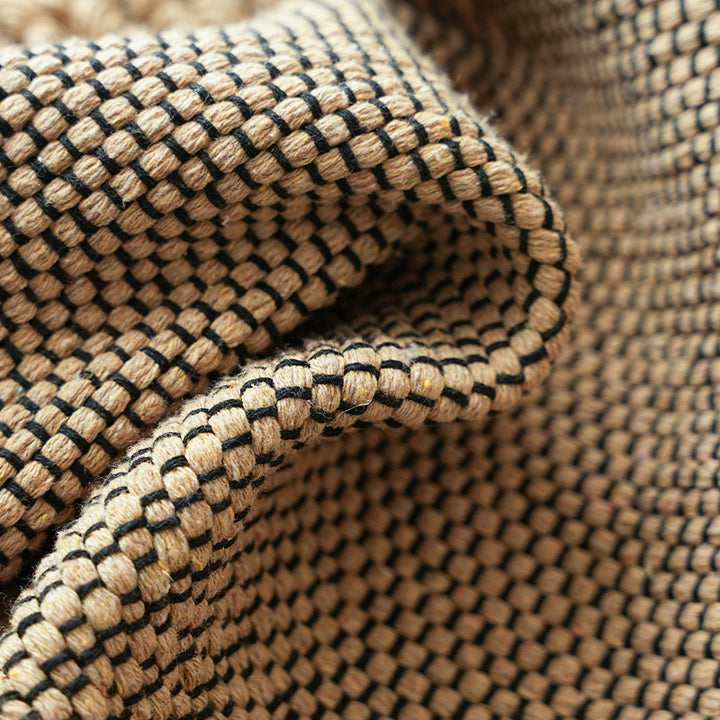 Handwoven structured cushion cover made of cotton blend with pompom trim