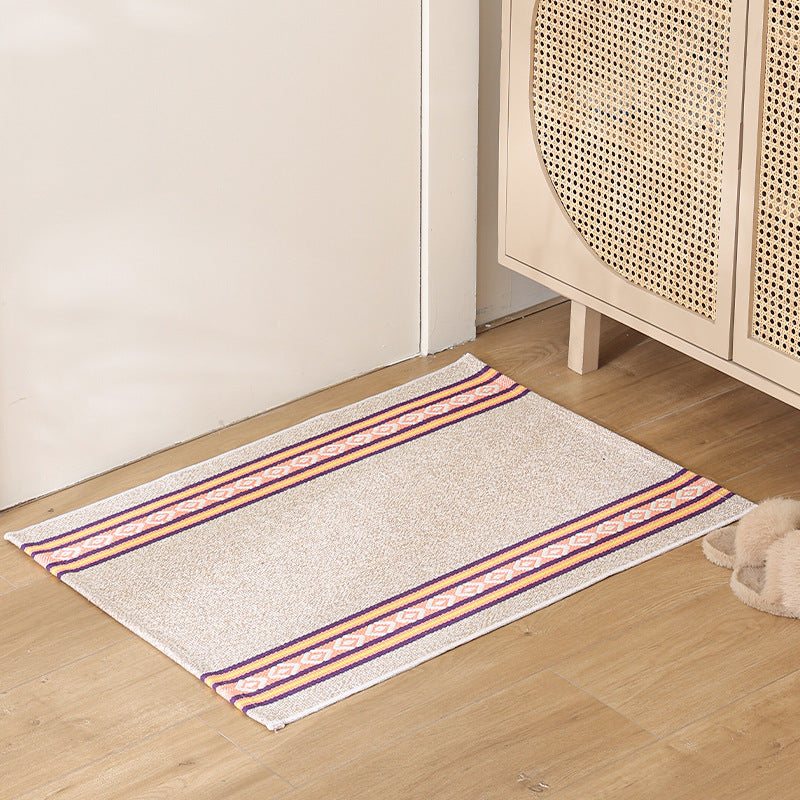 Striped cotton doormat with non-slip bottom and decorative woven edge