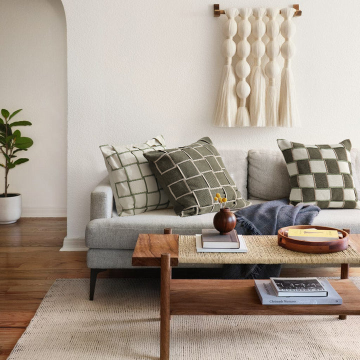 Decorative cushion cover with woven grid relief and contrasting piping