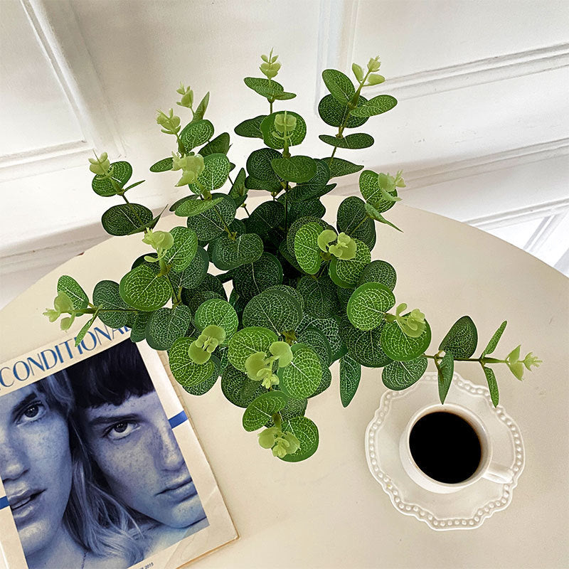 Artificial flowering branch with lifelike leaves and delicate flowers