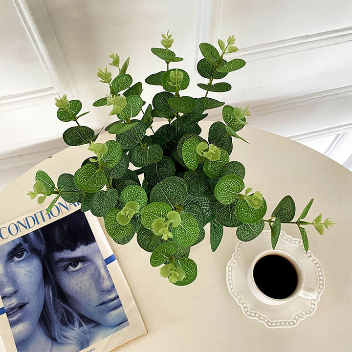 Artificial flowering branch with lifelike leaves and delicate flowers