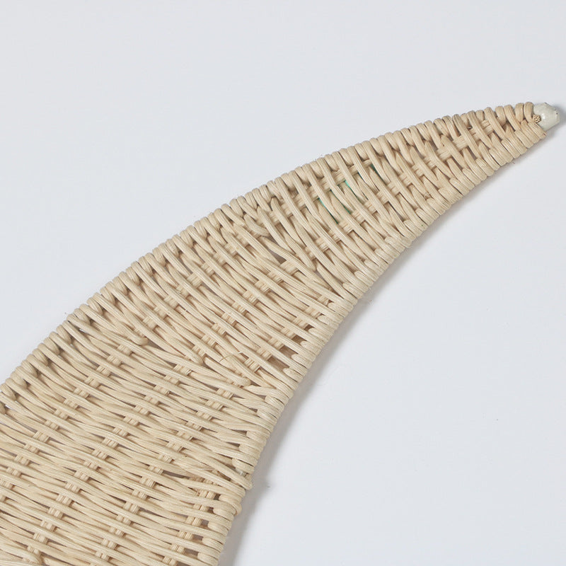 Wall decoration made of handwoven rattan in moon design