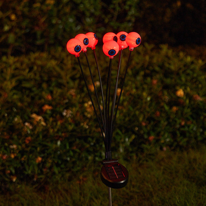 Creepy garden lights with eye motif