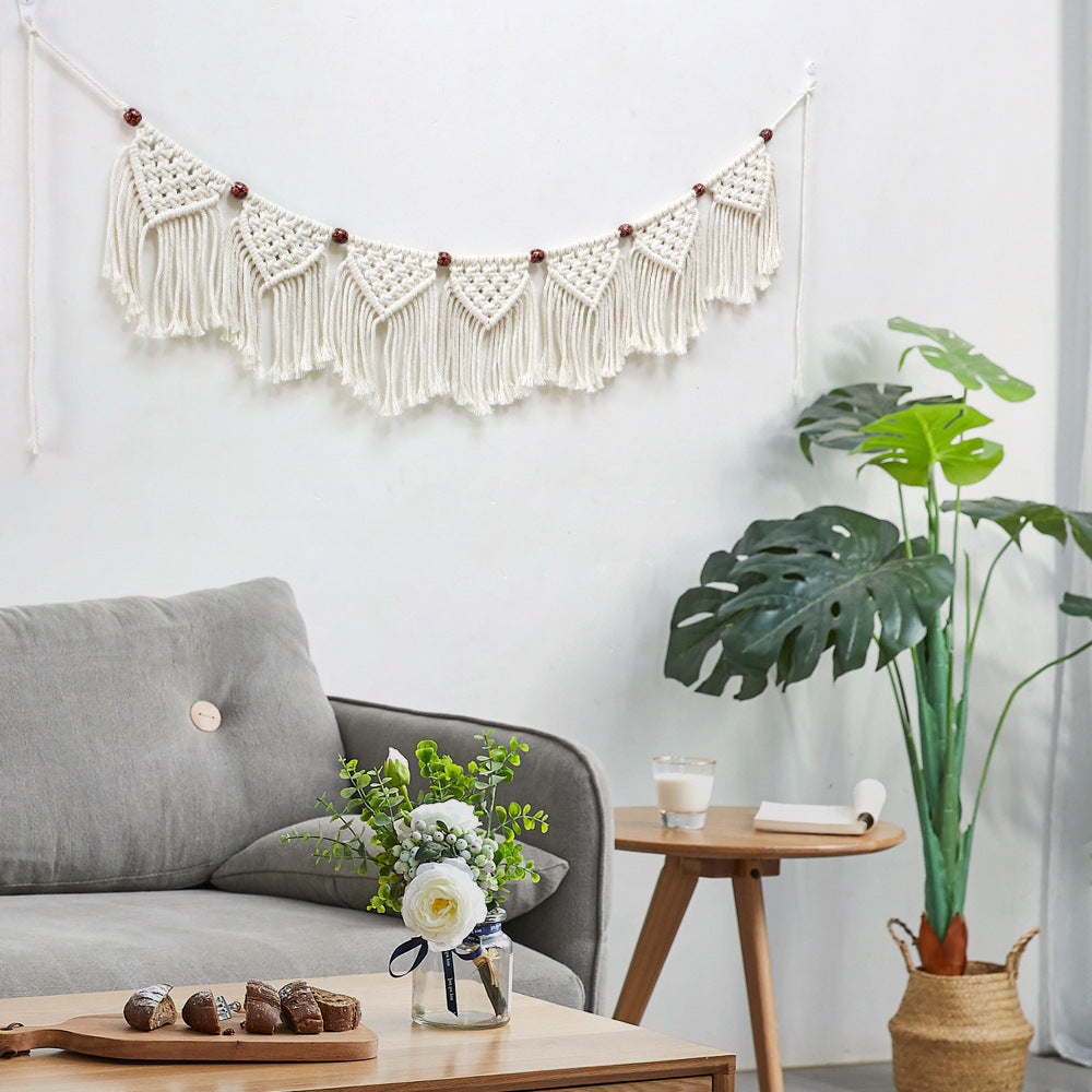 Decorative macrame wall hanging with ornate fringes