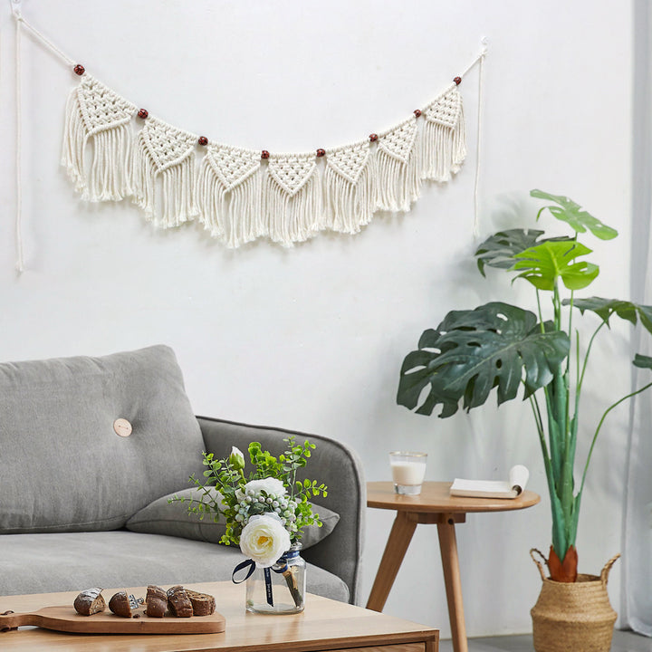 Decorative macrame wall hanging with ornate fringes