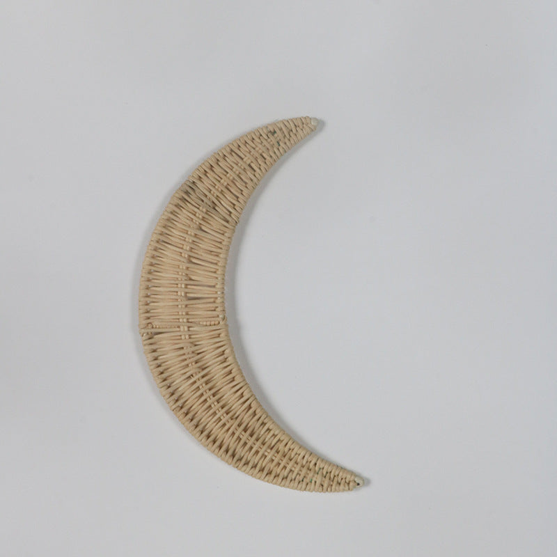 Wall decoration made of handwoven rattan in moon design