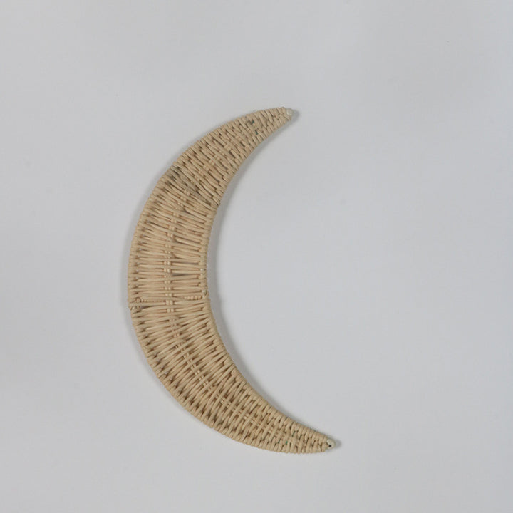 Wall decoration made of handwoven rattan in moon design