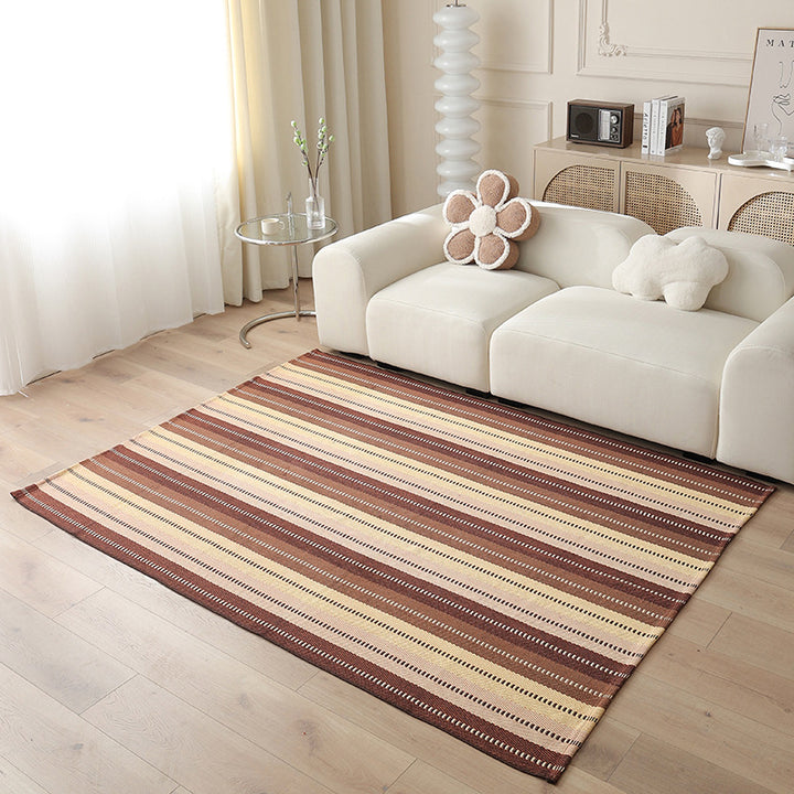 Woven living area rug with large check pattern and flat cotton texture
