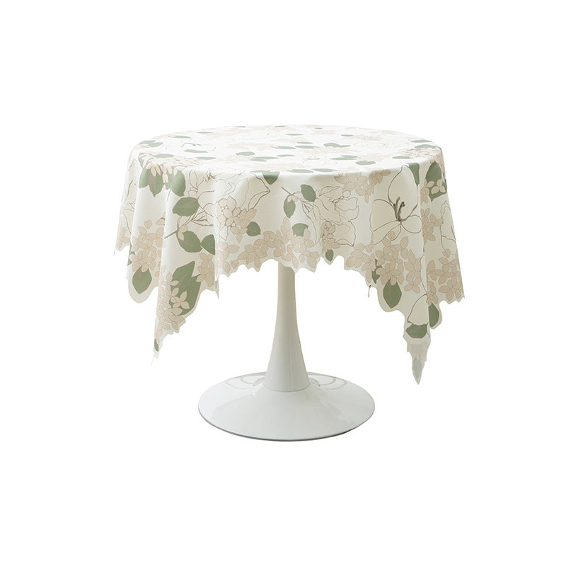 Round wipeable tablecloth with floral cut-out hem