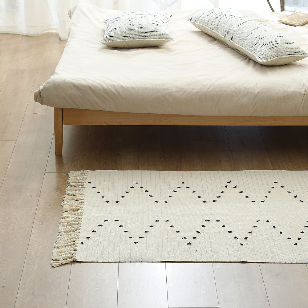 Handwoven cotton rug with dot tuft zigzag and fringed edge