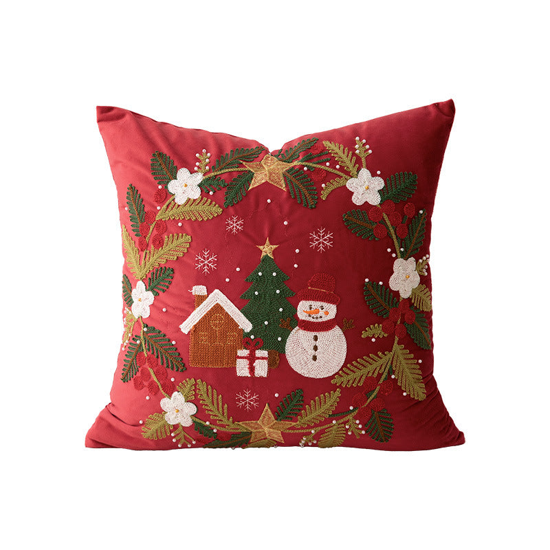Festive embroidered decorative pillow with reindeer motif and removable cover