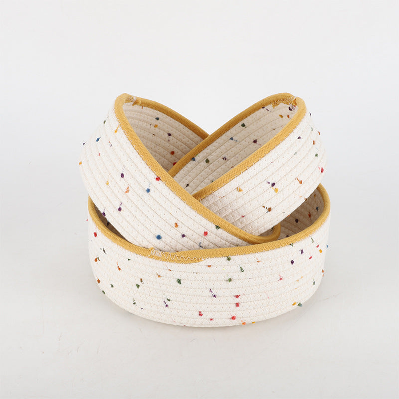 Storage basket made of natural cotton fabric with colorful dots