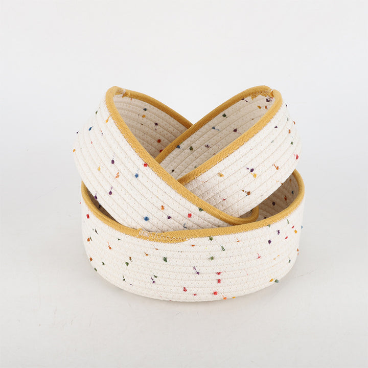 Storage basket made of natural cotton fabric with colorful dots