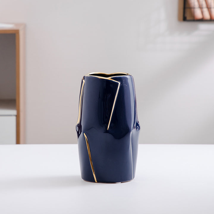 Decorative ceramic vase with golden accents