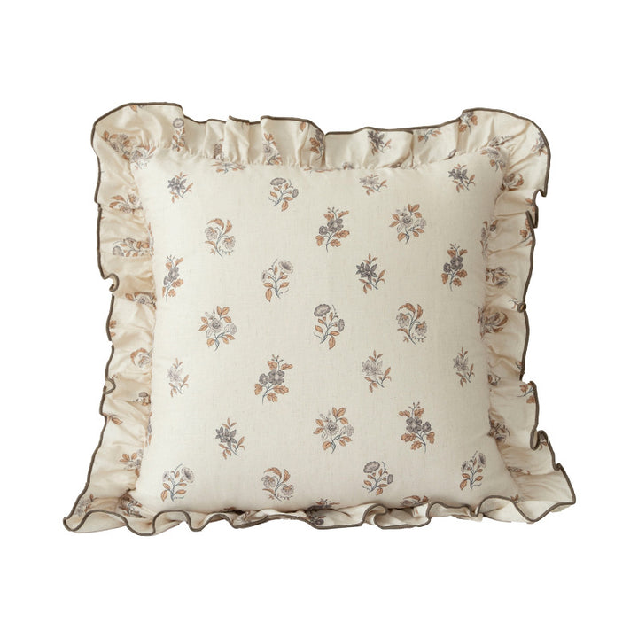 Decorative pillow with ruffles and floral linen cover