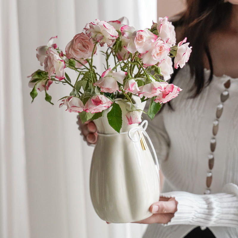 Artistic ceramic vase with decorative bow decoration