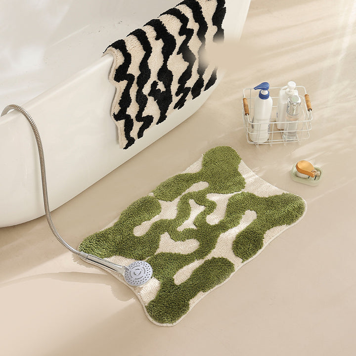 Hand-tufted bathroom bath mat with non-slip backing and textured square relief