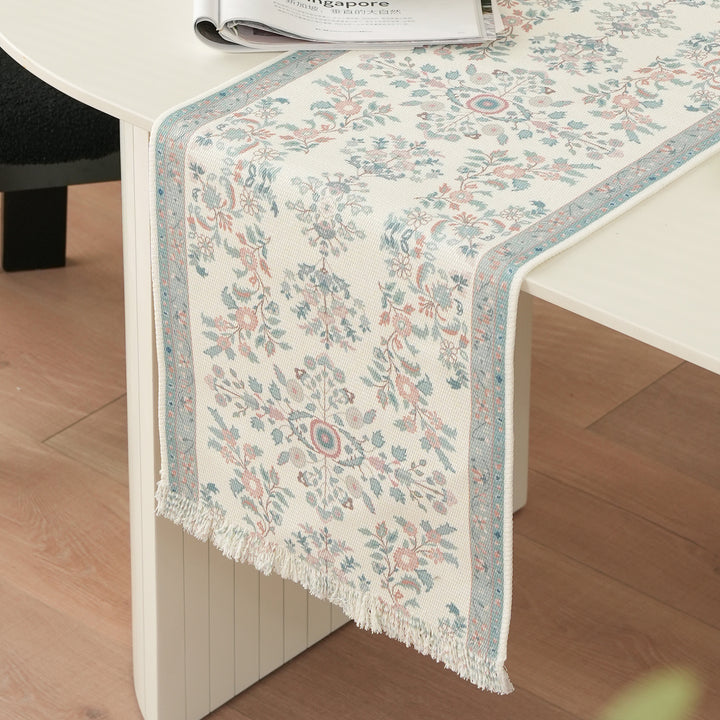 Woven jacquard table runner with floral medallion and fringes