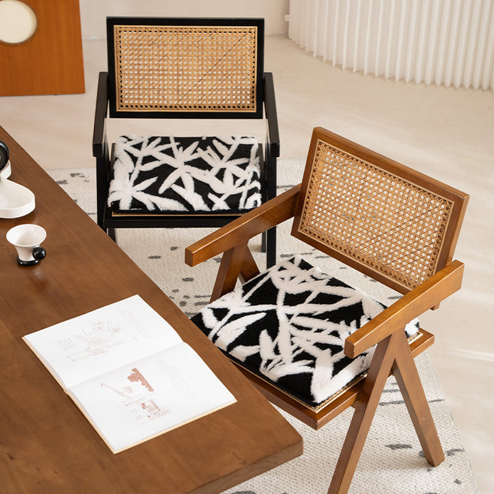 Padded seat cushion with hand-tufted leaf pattern and fastening ties