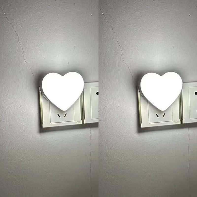 Heart-shaped plug-in ambient night light with soft LED lighting